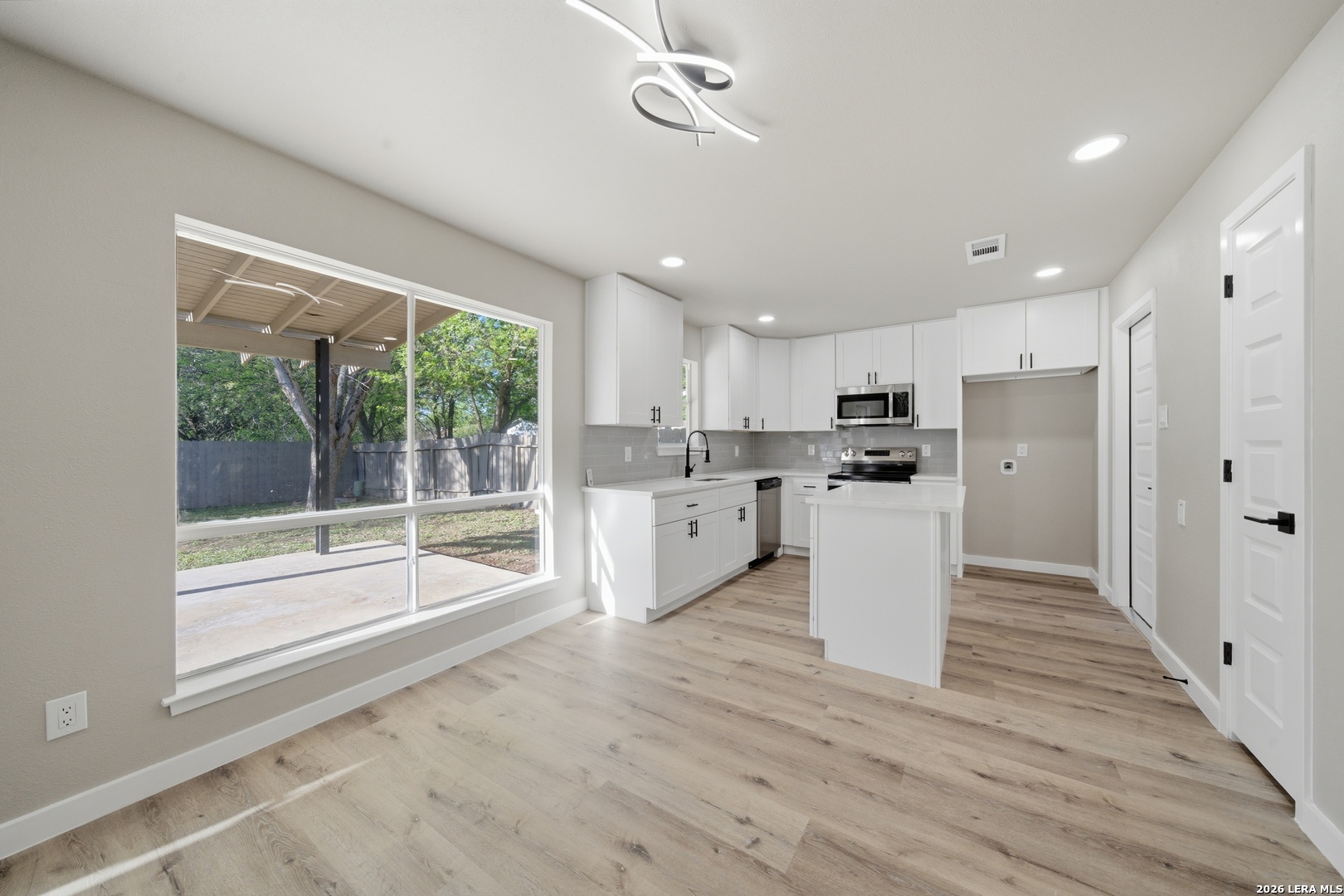 9446 Cliff Way Street San Antonio, TX 78250 - Photo 10 of 24 a view of kitchen with wooden floor