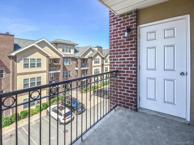 a view of a brick house with many windows