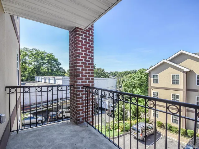 a view of a balcony with a pot
