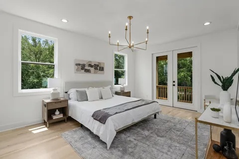 a spacious bedroom with a large bed and a window