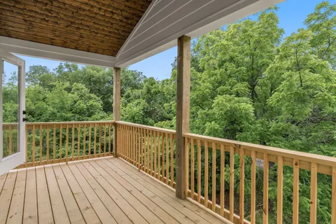 a view of balcony with wooden floor