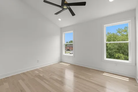 wooden floor in an empty room with a window