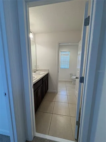 a bathroom with a toilet a sink and bathtub