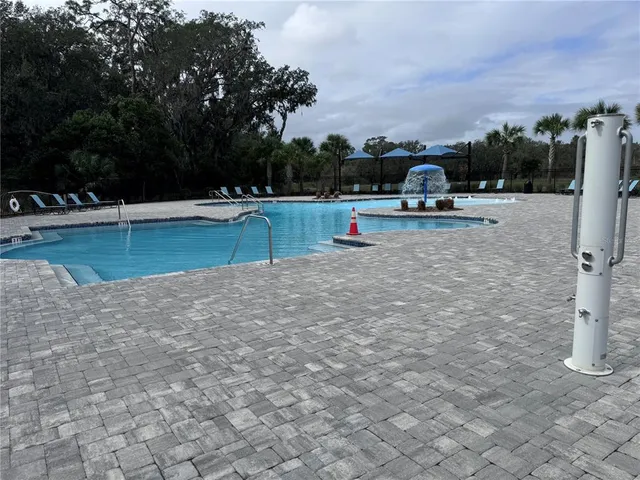 a front view of a house with swimming pool