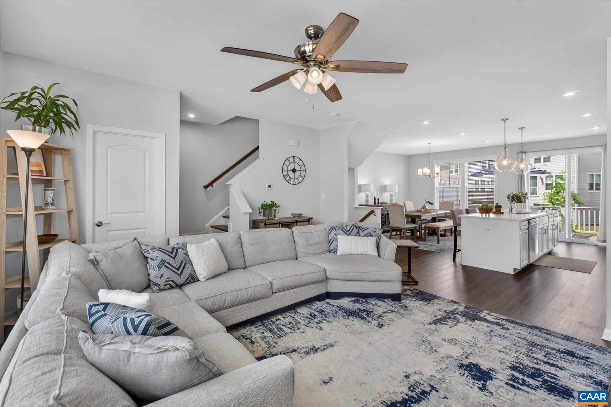 4418 Alston Street Crozet, VA 22932 - Photo 13 of 41 a living room with furniture kitchen view and a chandelier
