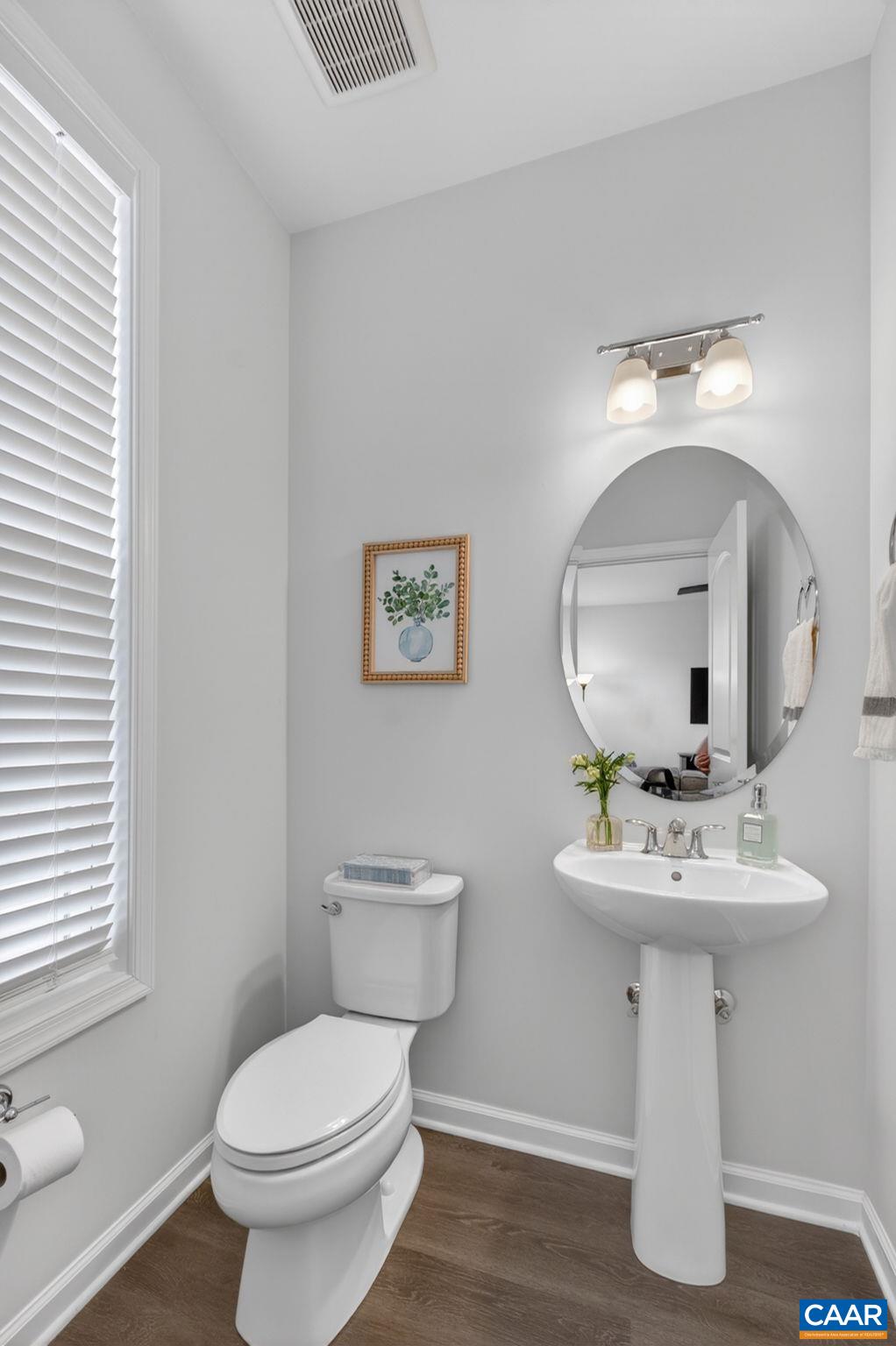 4418 Alston Street Crozet, VA 22932 - Photo 14 of 41 a bathroom with a toilet sink and mirror