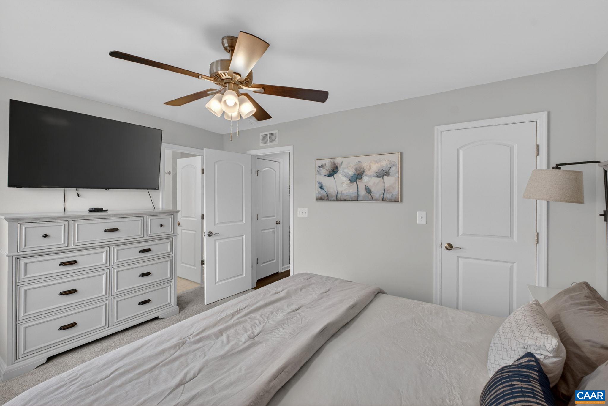 4418 Alston Street Crozet, VA 22932 - Photo 16 of 41 a bedroom with a bed and a flat screen tv