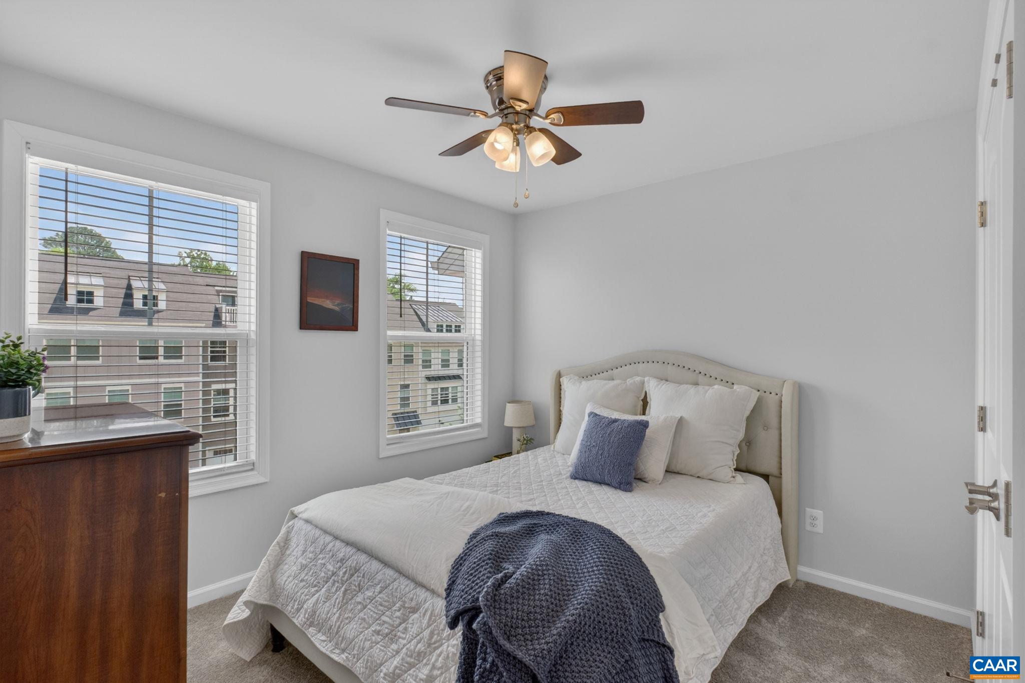 4418 Alston Street Crozet, VA 22932 - Photo 19 of 41 a bedroom with a bed and a chandelier