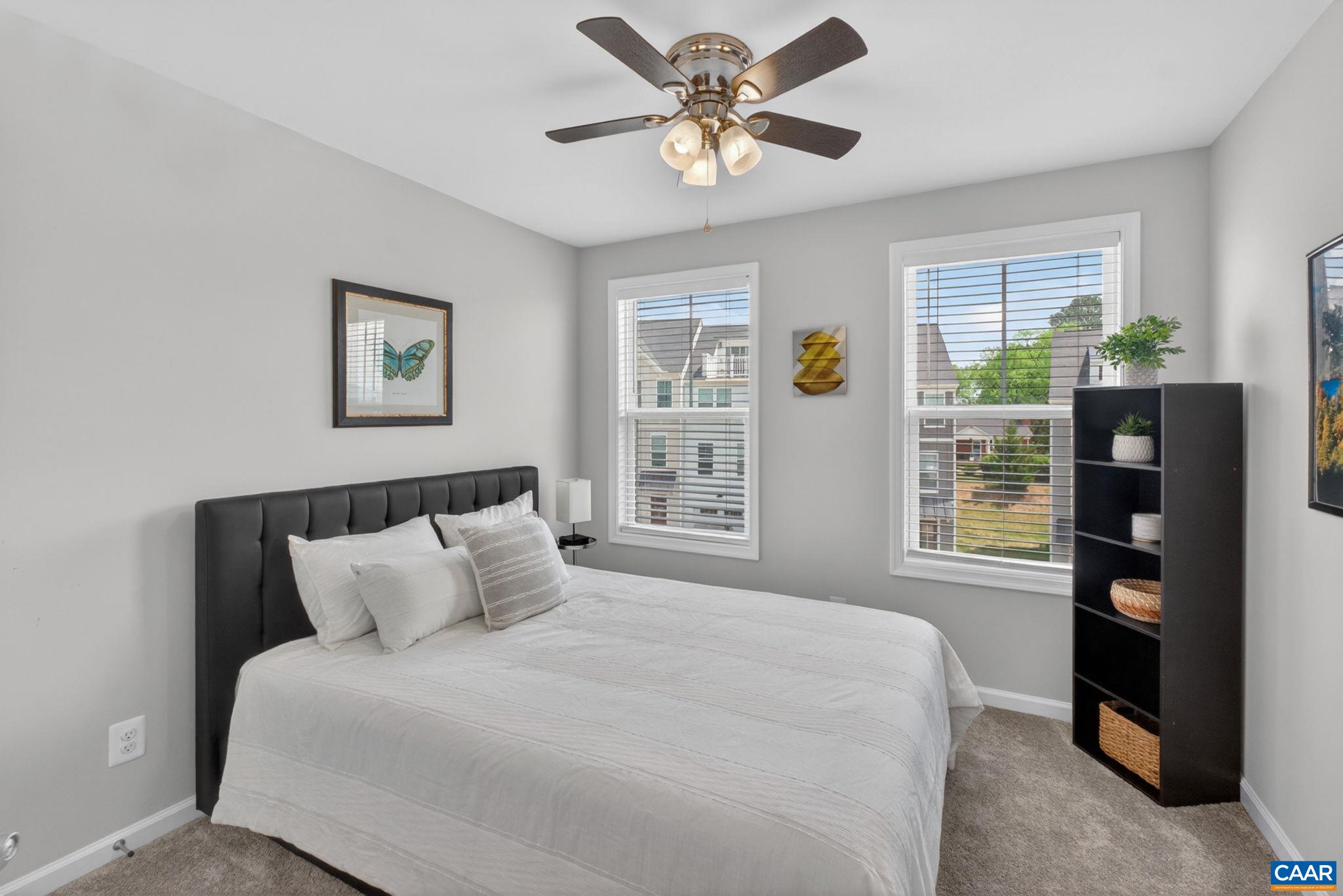 4418 Alston Street Crozet, VA 22932 - Photo 20 of 41 a bedroom with a bed and a chandelier