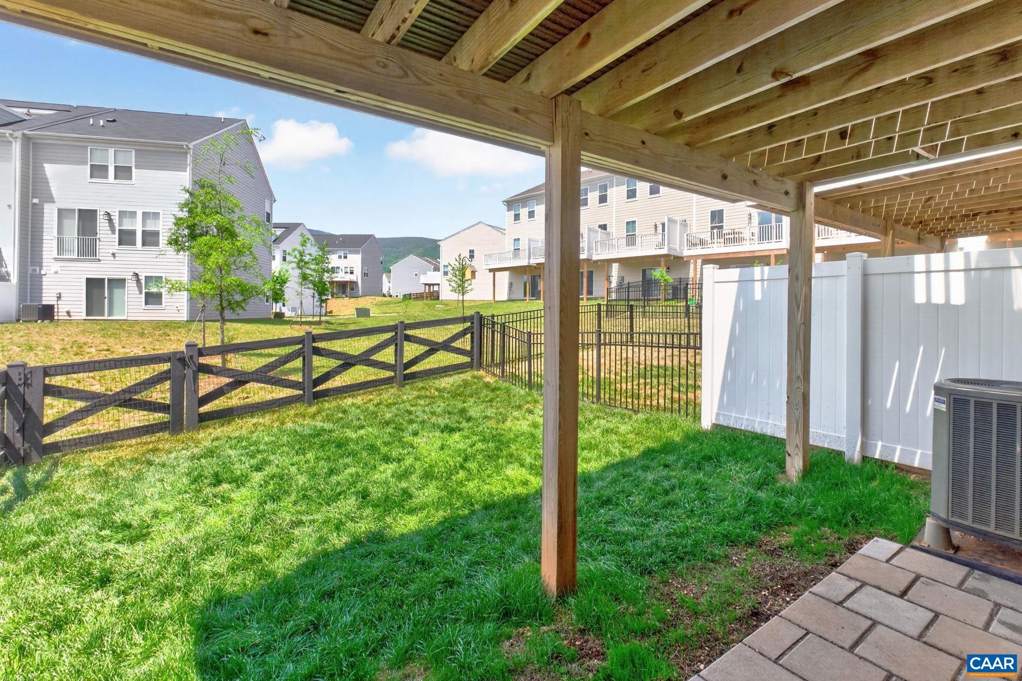 4418 Alston Street Crozet, VA 22932 - Photo 29 of 41 a view of a porch with a floor to ceiling windows and yard