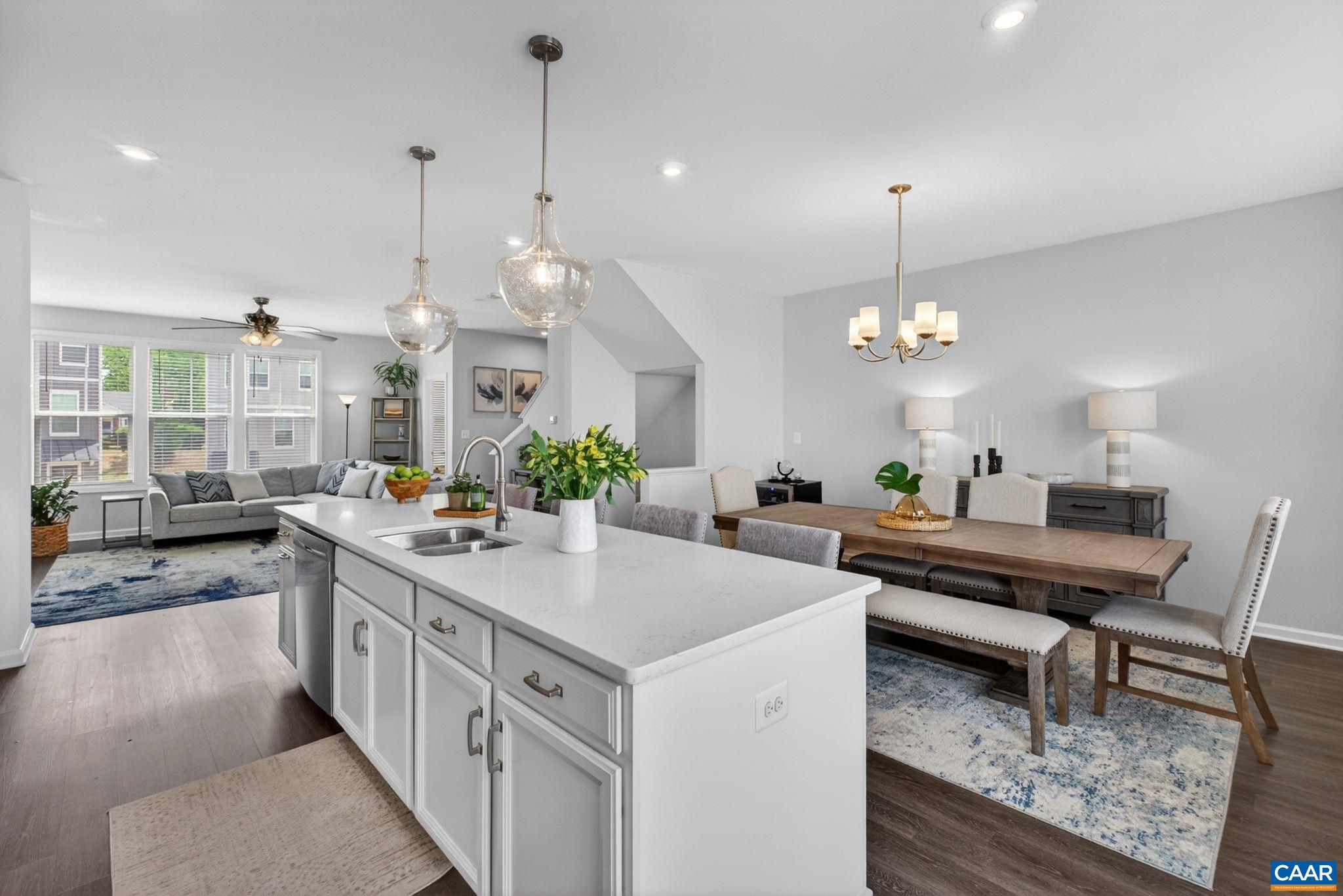4418 Alston Street Crozet, VA 22932 - Photo 5 of 41 a kitchen with stainless steel appliances a stove center island a dining table and chairs
