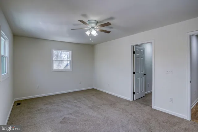 a bathroom with a shower sink and mirror
