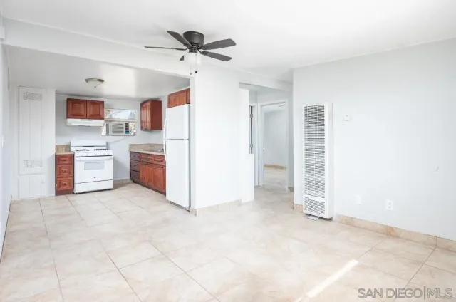 a view of a kitchen with electric appliances