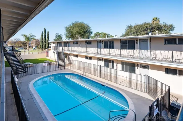 a view of a balcony with chairs