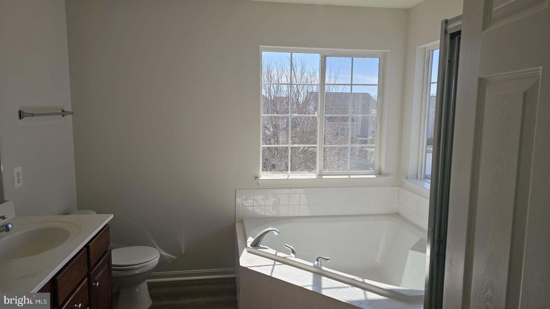 233 MacKenzie Lane Stephenson, VA 22656 - Photo 14 of 54 a bathroom with a sink toilet and window