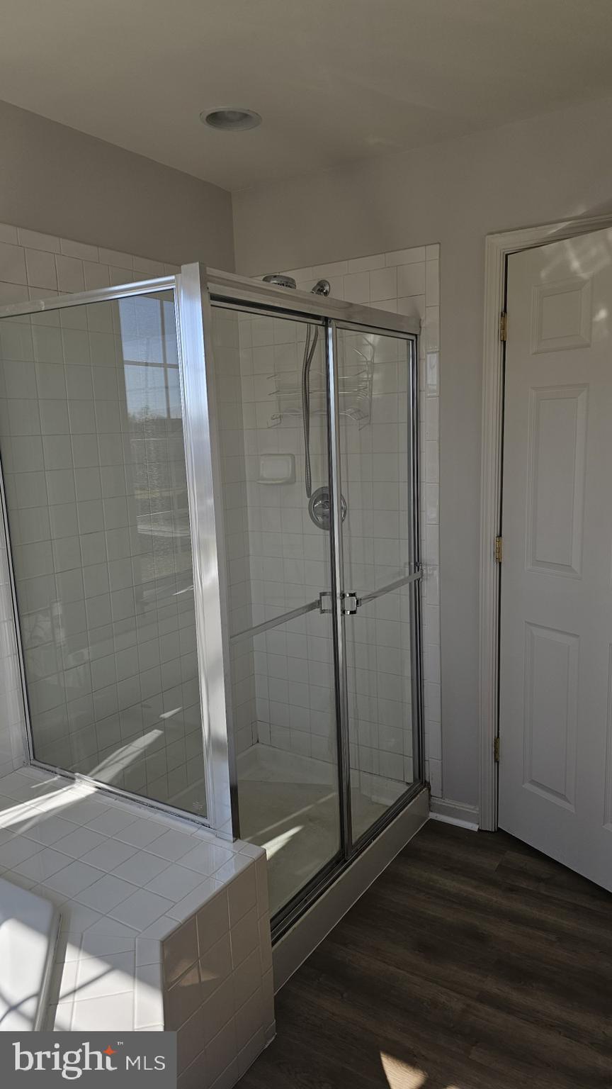 233 MacKenzie Lane Stephenson, VA 22656 - Photo 15 of 54 a bathroom with a glass shower door