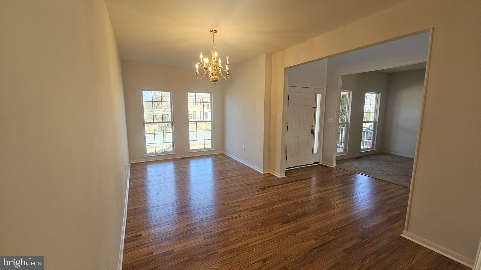 233 MacKenzie Lane Stephenson, VA 22656 - Photo 23 of 54 an empty room with wooden floor and windows