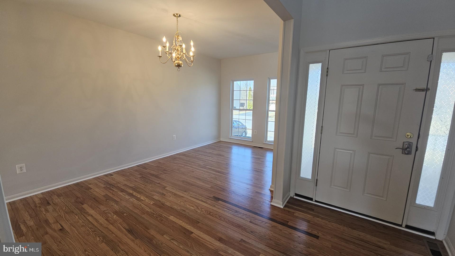 233 MacKenzie Lane Stephenson, VA 22656 - Photo 24 of 54 wooden floor in an empty room with a window