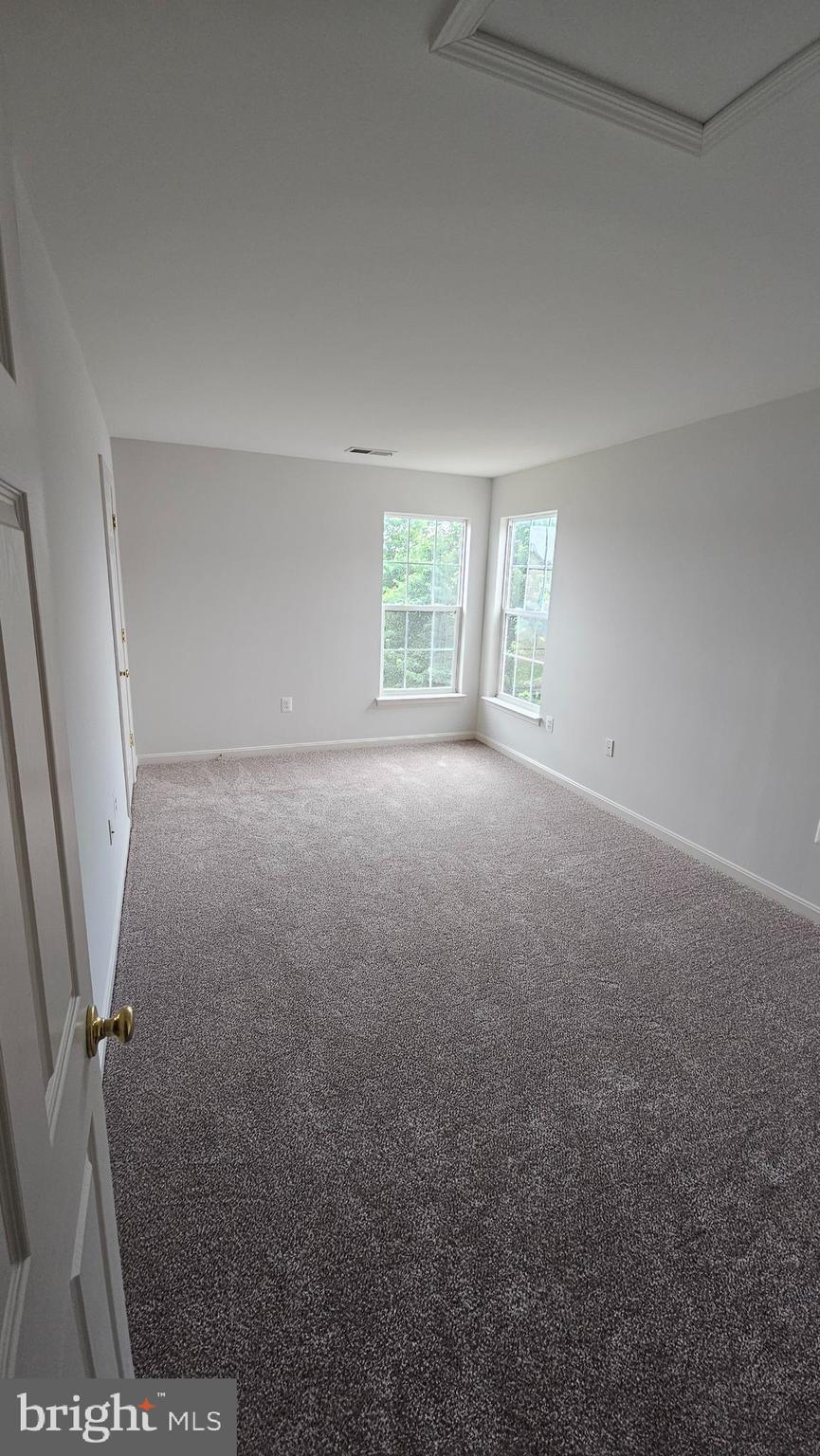 233 MacKenzie Lane Stephenson, VA 22656 - Photo 29 of 54 an empty room with windows
