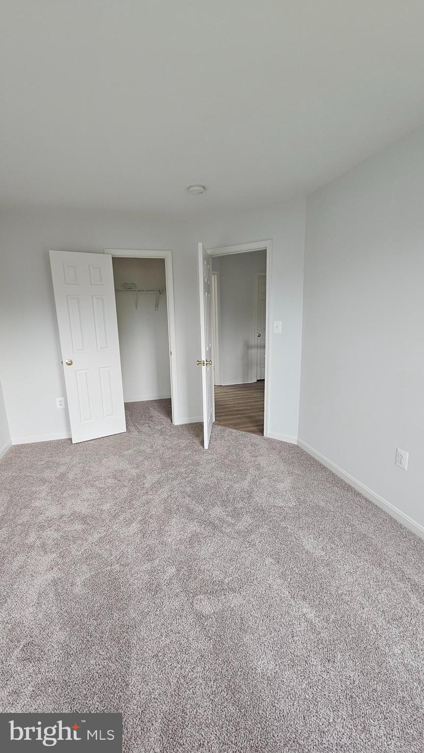233 MacKenzie Lane Stephenson, VA 22656 - Photo 30 of 54 a view of an empty room and chandelier