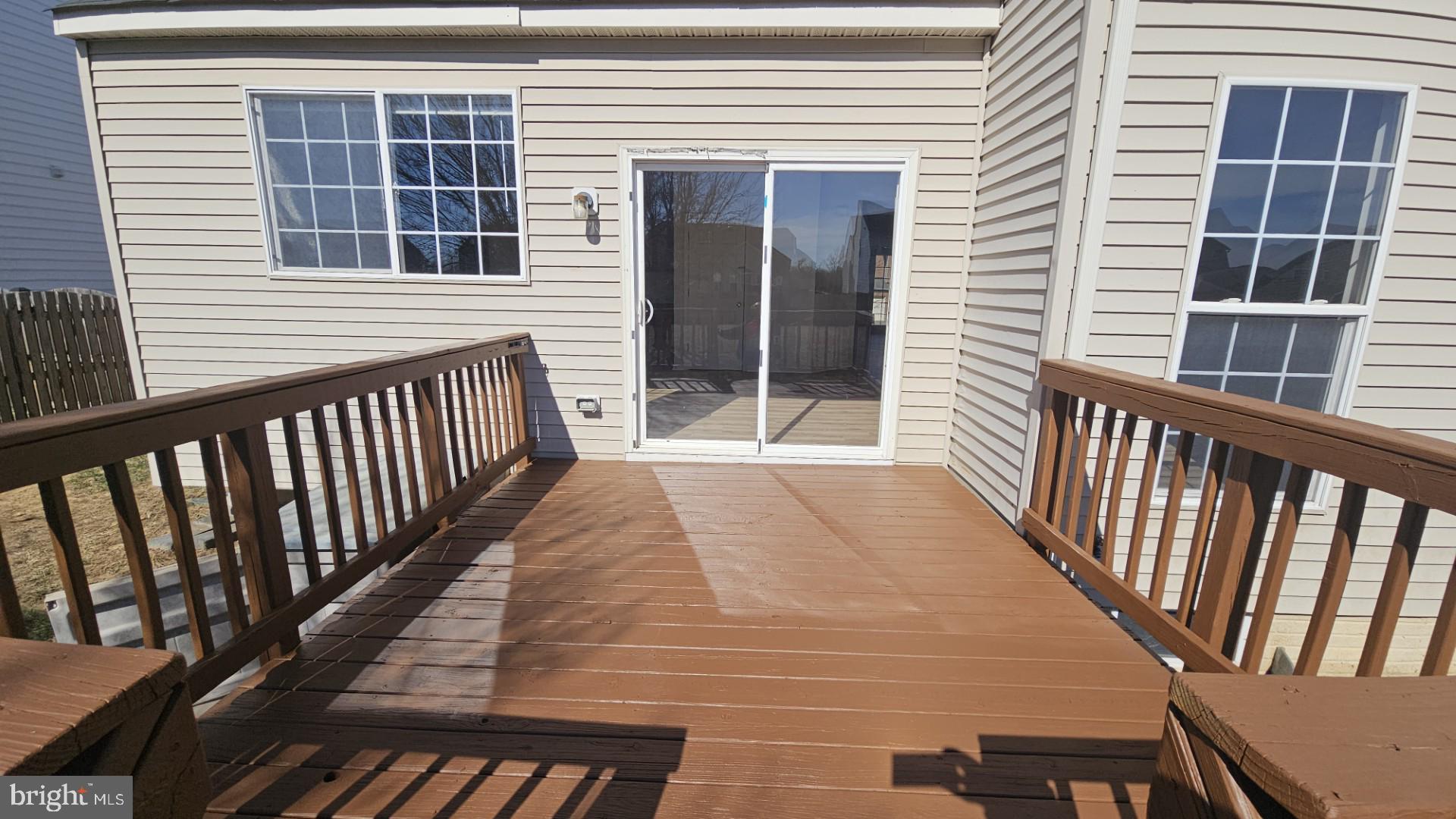 233 MacKenzie Lane Stephenson, VA 22656 - Photo 5 of 54 a view of balcony with wooden floor and fence