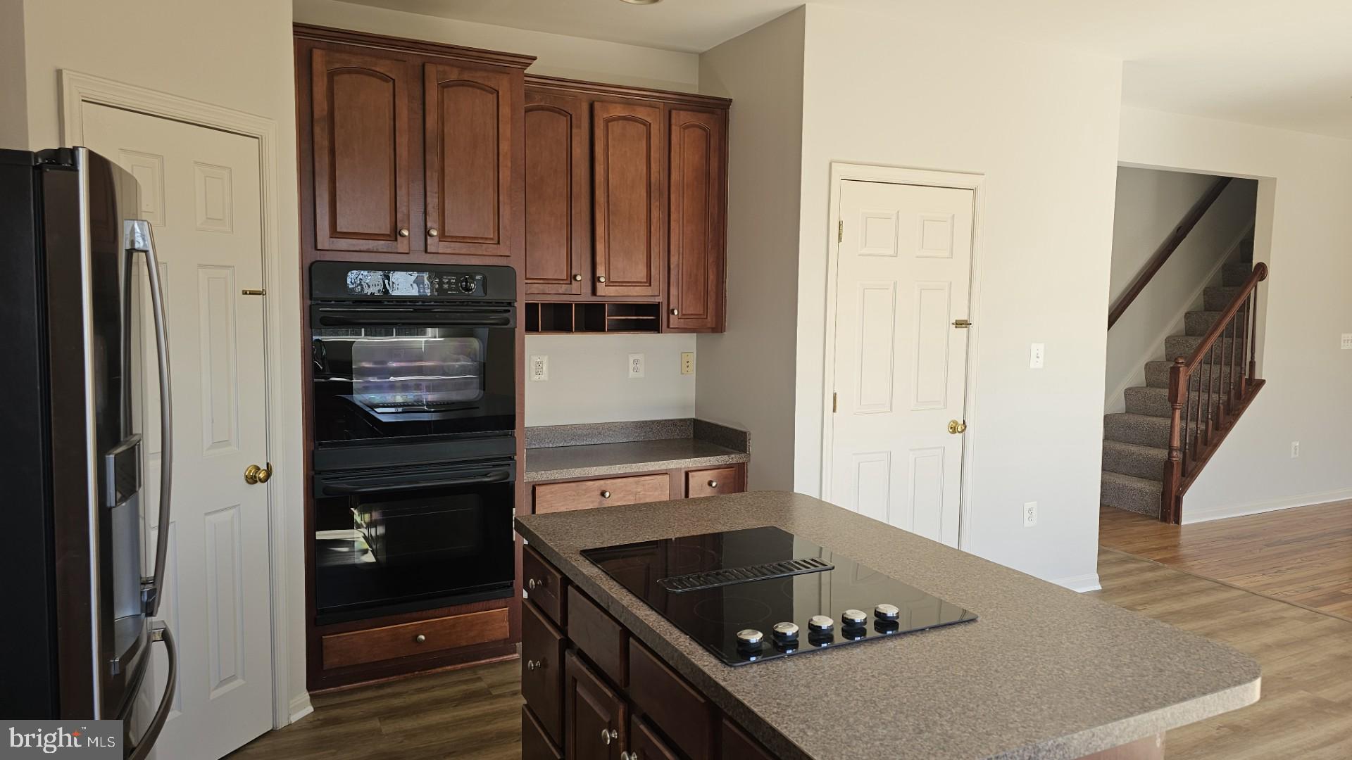233 MacKenzie Lane Stephenson, VA 22656 - Photo 7 of 54 a kitchen with stainless steel appliances granite countertop a refrigerator and a stove