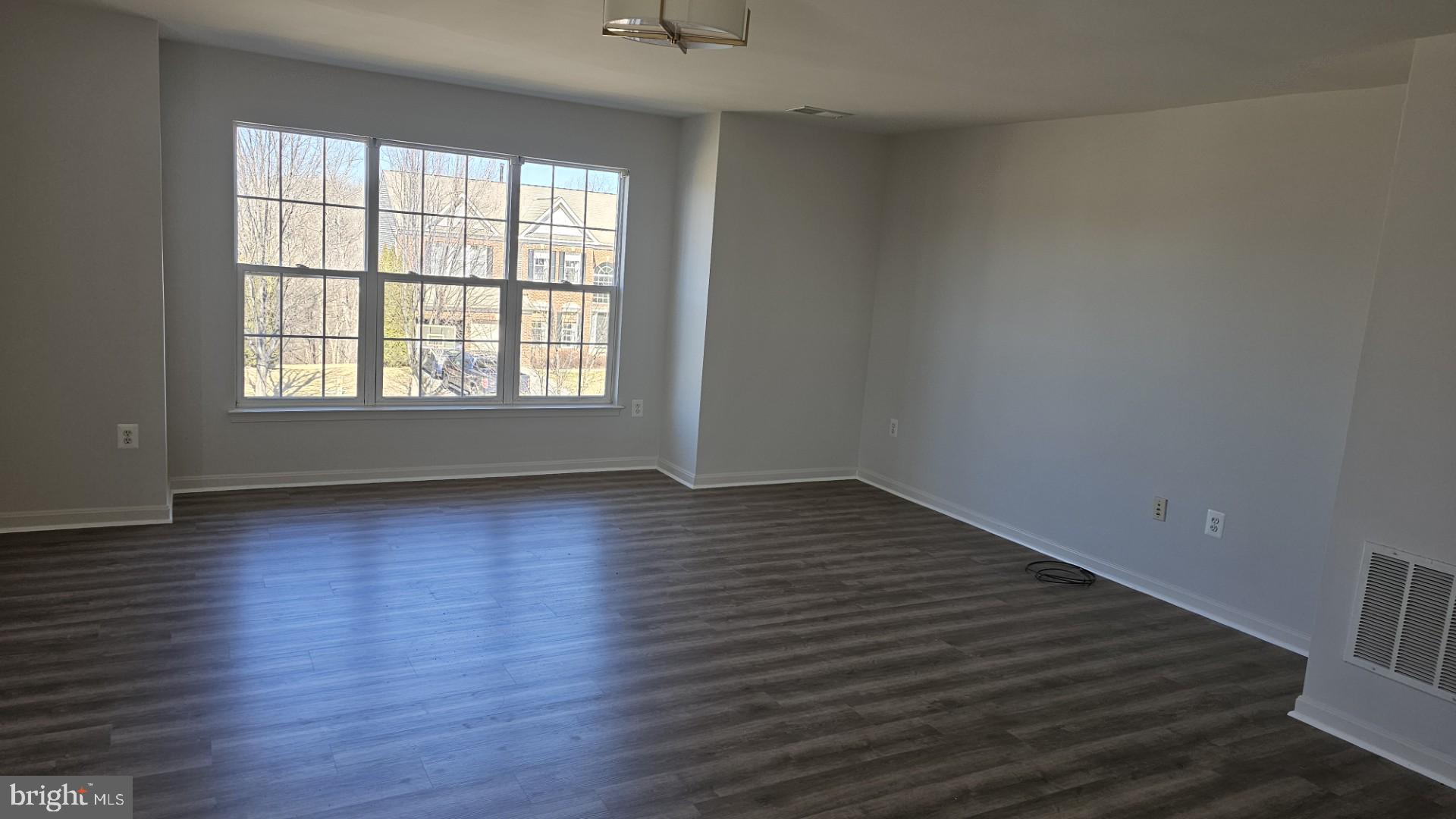 233 MacKenzie Lane Stephenson, VA 22656 - Photo 10 of 54 wooden floor in an empty room with a window