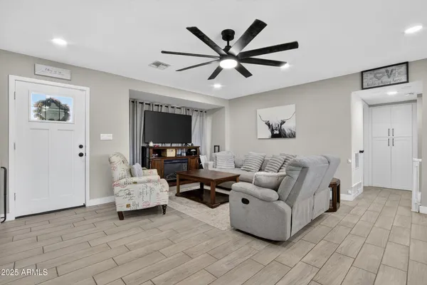 a living room with furniture and a flat screen tv