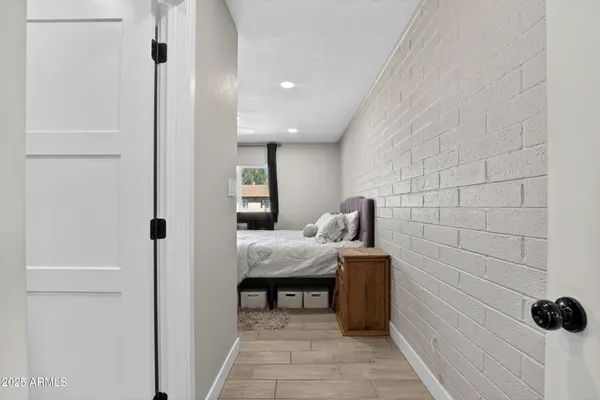 a bed room with a bed and a window