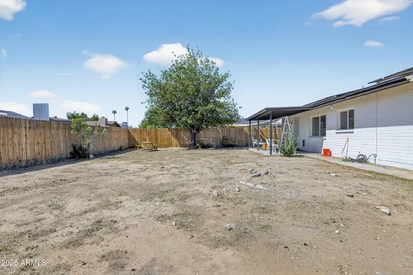 a view of a house with a yard and garage