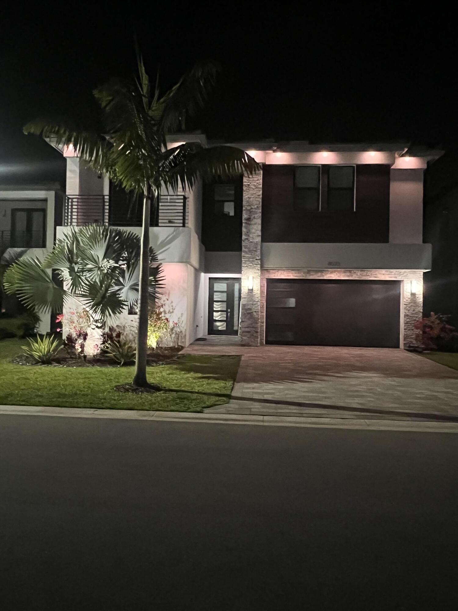 8573 Crystal Downs Avenue Boca Raton, FL 33434 - Photo 3 of 82 a front view of a house with a yard