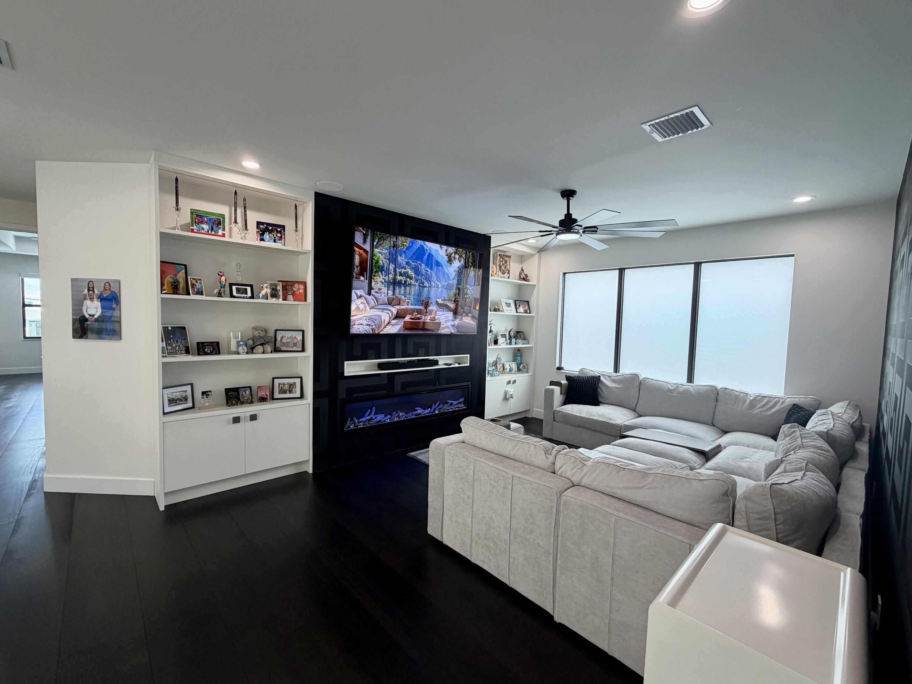 8573 Crystal Downs Avenue Boca Raton, FL 33434 - Photo 31 of 82 a living room with furniture and a flat screen tv