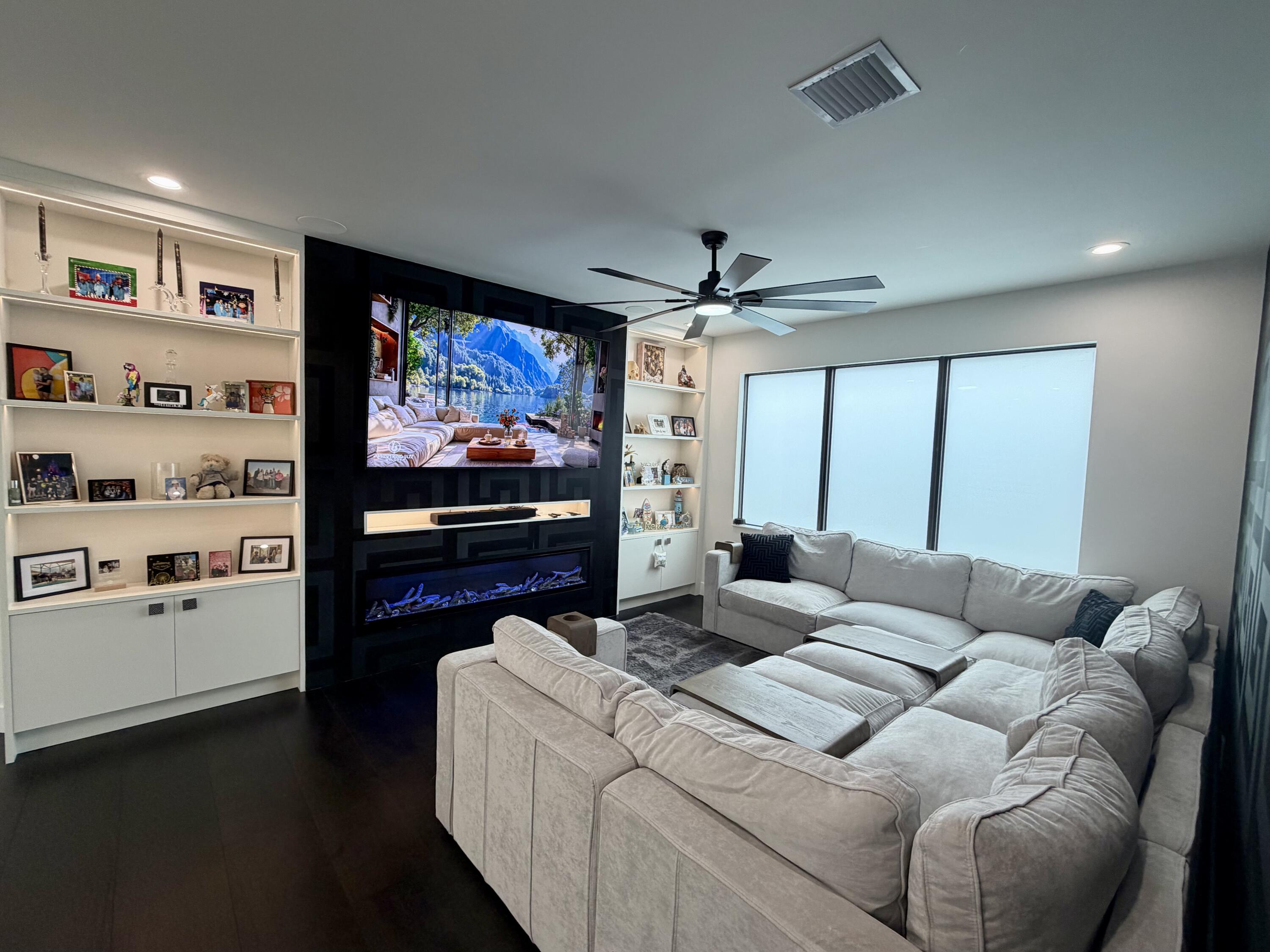 8573 Crystal Downs Avenue Boca Raton, FL 33434 - Photo 32 of 82 a living room with furniture and a flat screen tv