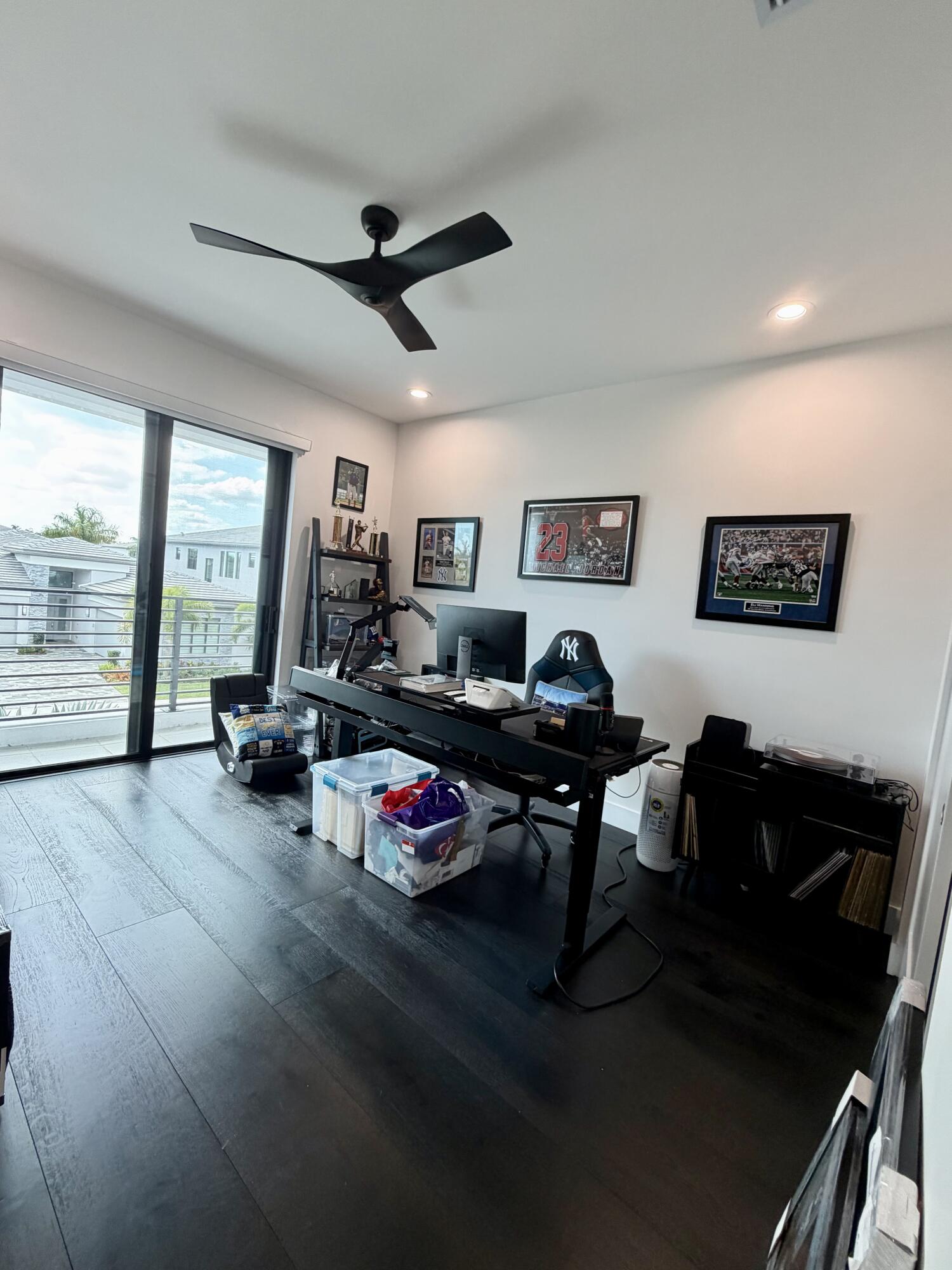 8573 Crystal Downs Avenue Boca Raton, FL 33434 - Photo 40 of 82 a living room with furniture a flat screen tv and a large window