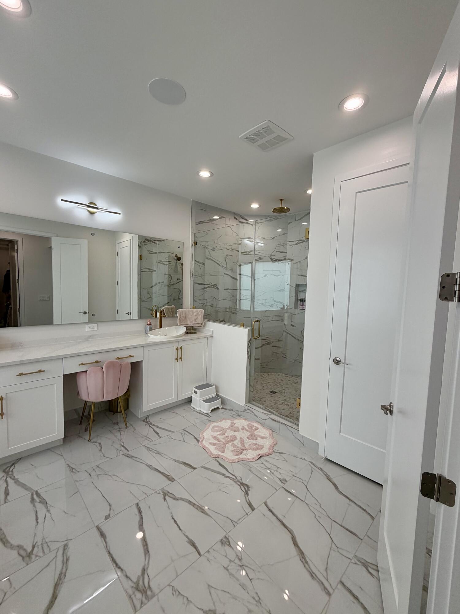 8573 Crystal Downs Avenue Boca Raton, FL 33434 - Photo 49 of 82 a large bathroom with a double vanity sink and a mirror