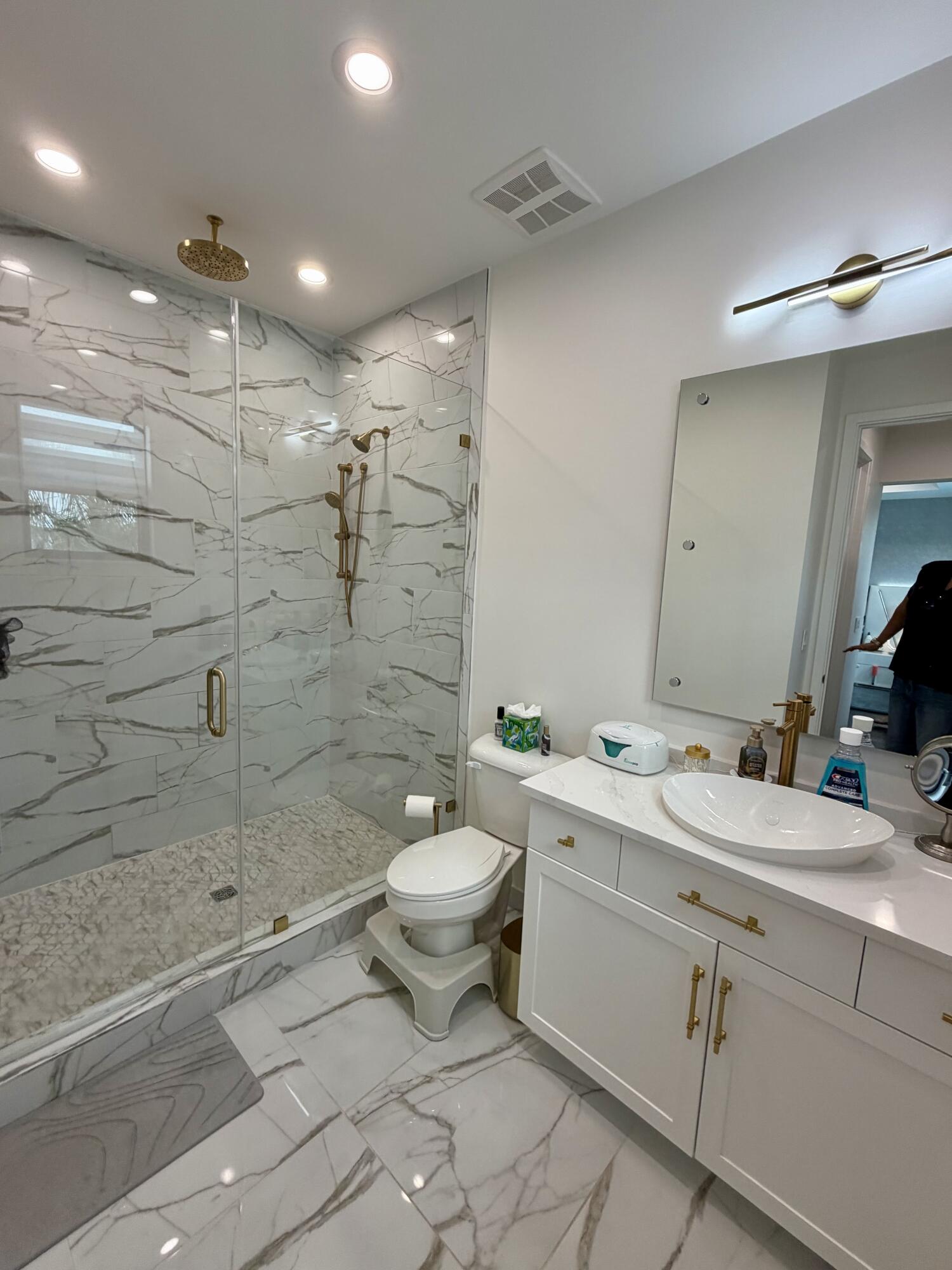 8573 Crystal Downs Avenue Boca Raton, FL 33434 - Photo 51 of 82 a bathroom with a double vanity sink toilet and shower