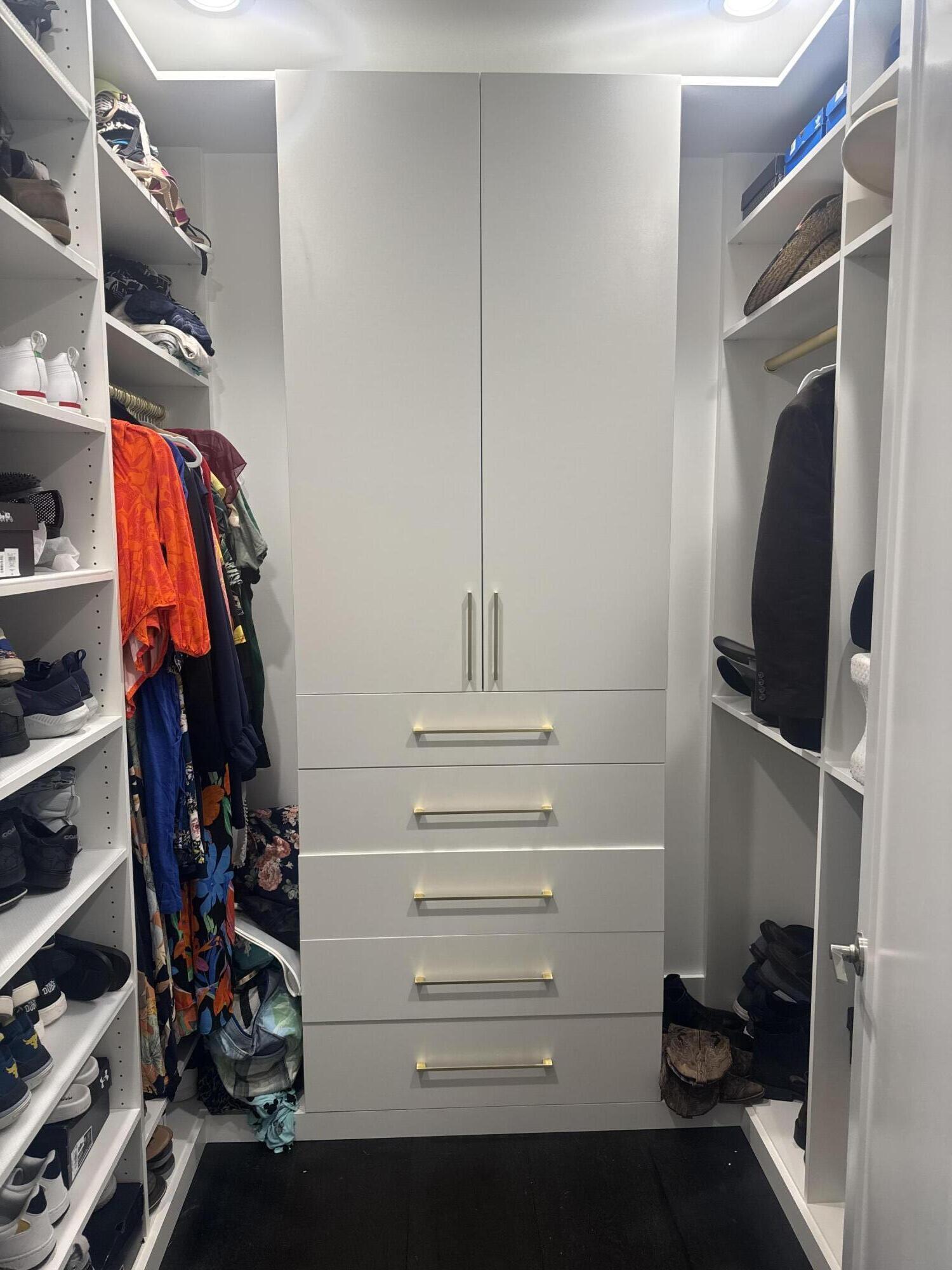 8573 Crystal Downs Avenue Boca Raton, FL 33434 - Photo 52 of 82 a view of walk in closet with clothes and shoes