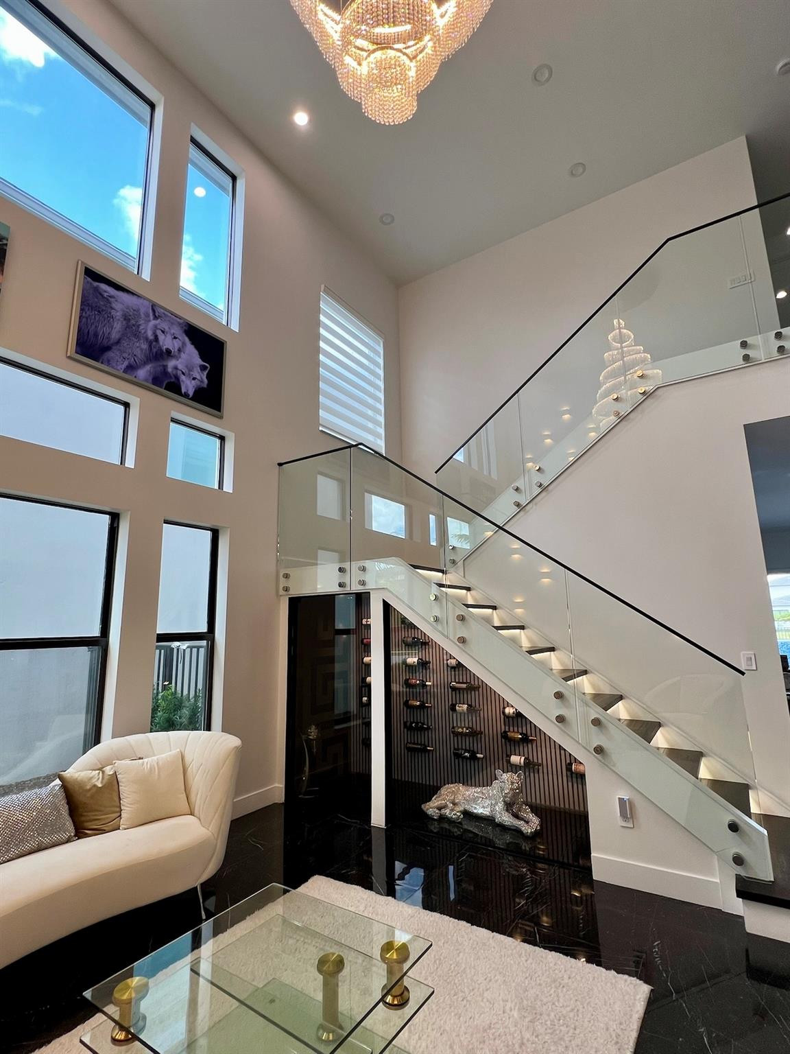 8573 Crystal Downs Avenue Boca Raton, FL 33434 - Photo 7 of 82 a living room with furniture and a chandelier