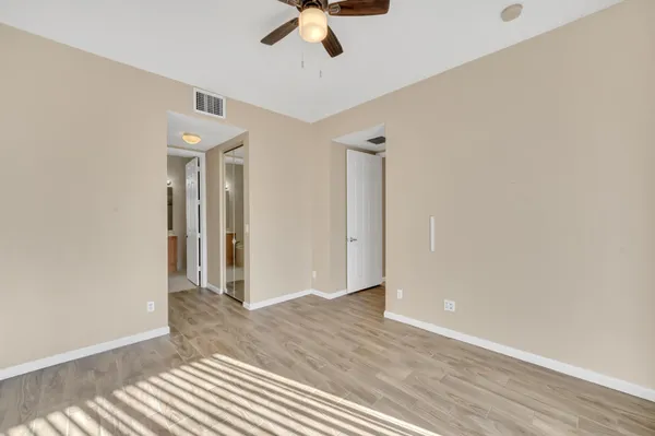 a view of livingroom with hardwood floor and a ceiling fan