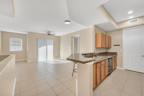 a kitchen with stainless steel appliances granite countertop a stove and a sink