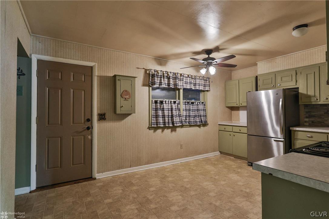 1034 Pine Tree Drive Slatington, PA 18080 - Photo 12 of 46 a kitchen with refrigerator and cabinets