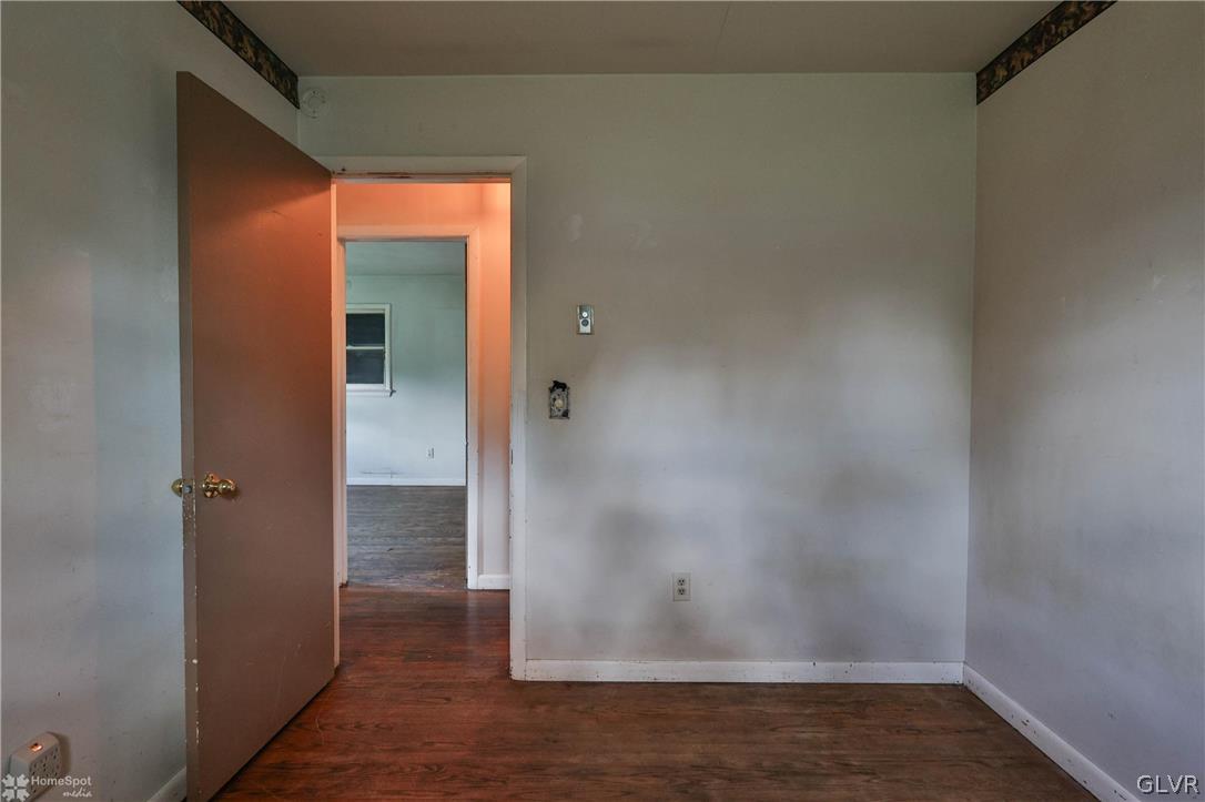 1034 Pine Tree Drive Slatington, PA 18080 - Photo 17 of 46 an empty room with wooden floor and closet