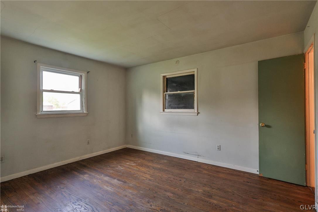 1034 Pine Tree Drive Slatington, PA 18080 - Photo 22 of 46 a view of a room that has wooden floor and windows in it