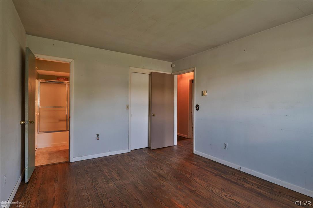 1034 Pine Tree Drive Slatington, PA 18080 - Photo 24 of 46 an empty room with wooden floor and closet