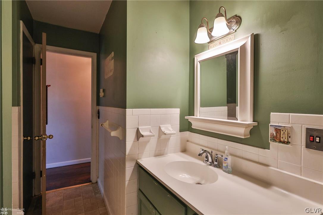 1034 Pine Tree Drive Slatington, PA 18080 - Photo 27 of 46 a bathroom with a sink vanity and a mirror