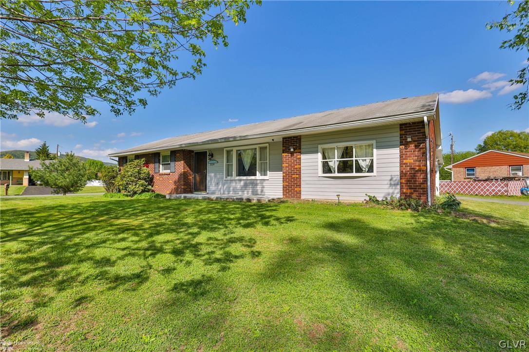 1034 Pine Tree Drive Slatington, PA 18080 - Photo 3 of 46 a front view of house with yard and green space
