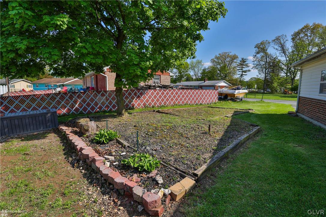 1034 Pine Tree Drive Slatington, PA 18080 - Photo 38 of 46 a view of a backyard with wooden fence