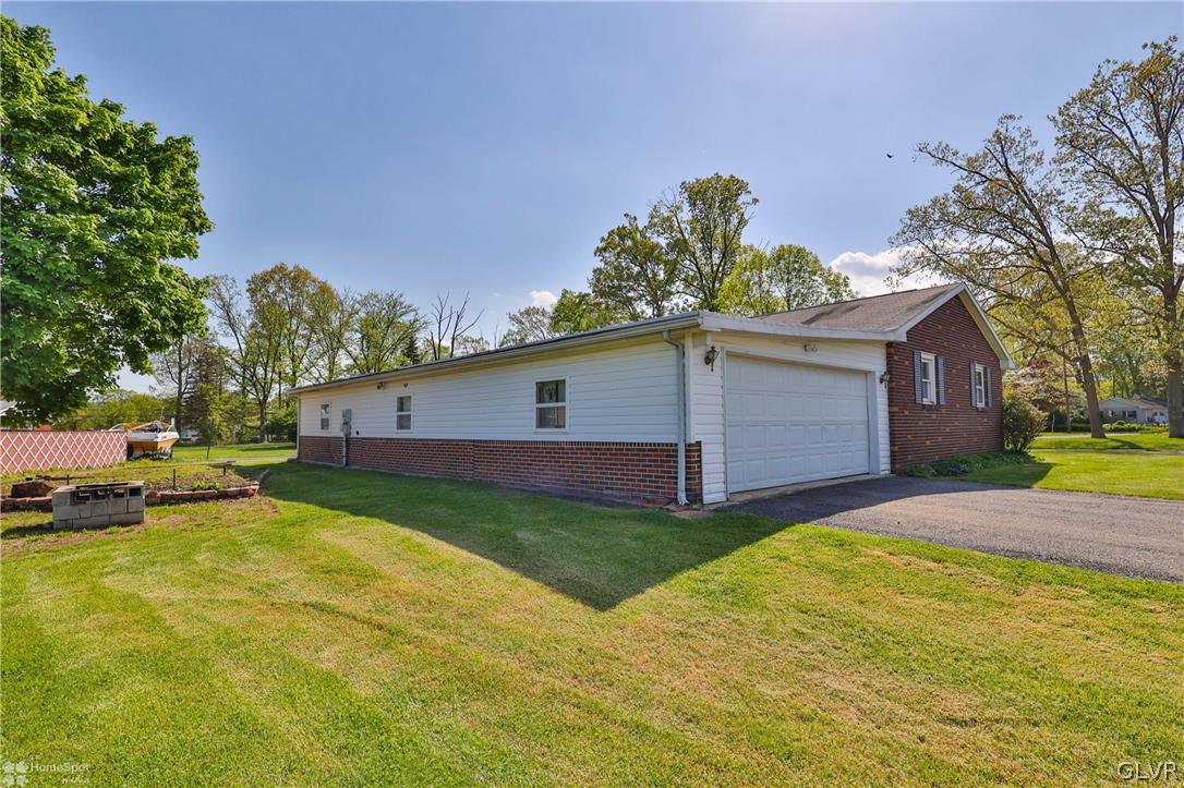 1034 Pine Tree Drive Slatington, PA 18080 - Photo 39 of 46 a view of a yard with a house and a big yard