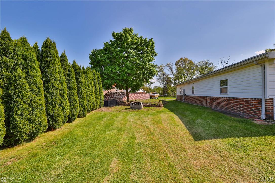 1034 Pine Tree Drive Slatington, PA 18080 - Photo 40 of 46 a swimming pool with a yard