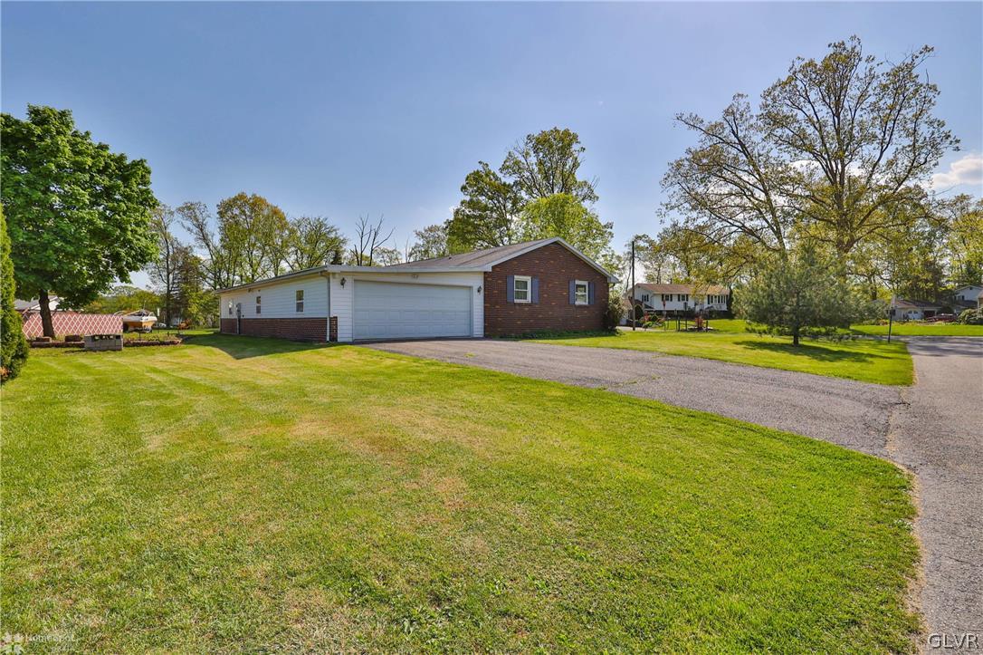 1034 Pine Tree Drive Slatington, PA 18080 - Photo 41 of 46 a view of a house with a big yard